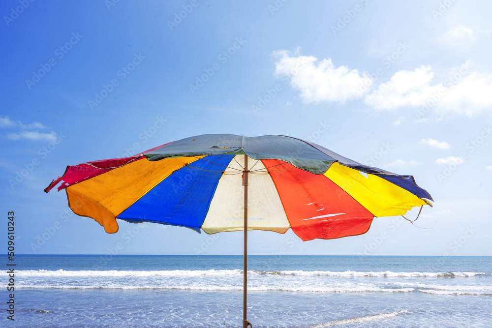 Beach with colorful umbrella in summer holiday