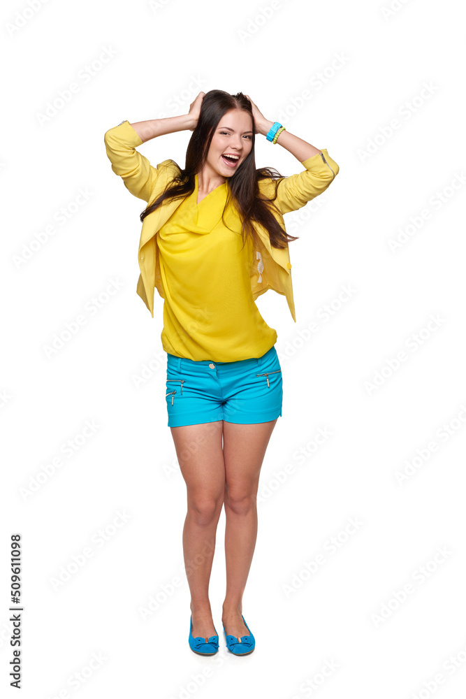 Full length of happy young girl in yellow and blue clothes screaming of joy Full length of happy young girl in yellow and blue clothes screaming of joy