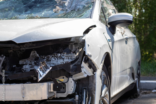 Traffic accident on the street, damaged car after a collision in the city. Accident due to speeding and alcohol intoxication. Transport background. The concept of road safety and insurance.