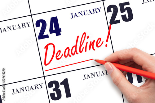 Hand drawing red line and writing the text Deadline on calendar date January 24. Deadline word written on calendar