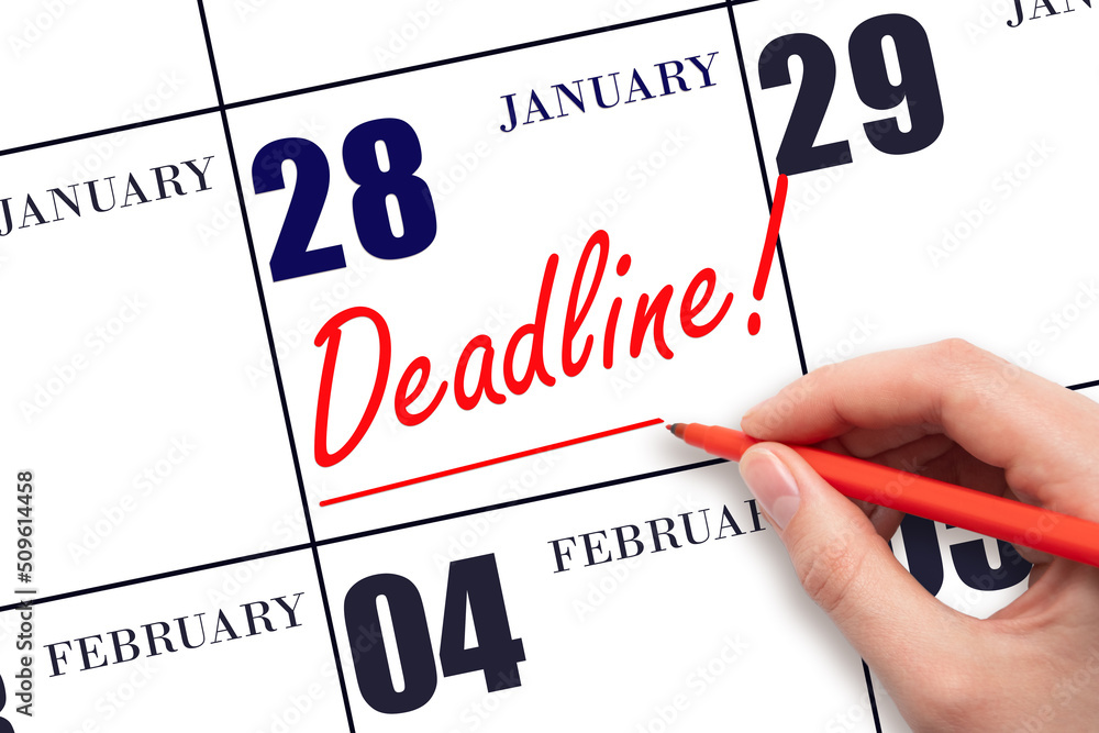Hand drawing red line and writing the text Deadline on calendar date January 28. Deadline word written on calendar Hand drawing red line and writing the text Deadline on calendar date January 28. Deadline word written on calendar