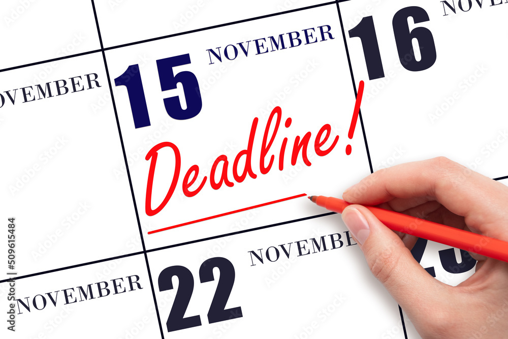Hand drawing red line and writing the text Deadline on calendar date November 15. Deadline word written on calendar Hand drawing red line and writing the text Deadline on calendar date November 15. Deadline word written on calendar