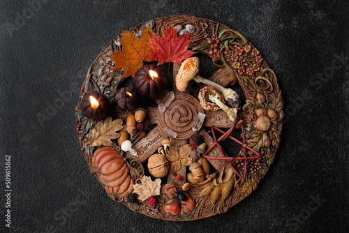 witch altar for Samhain sabbat, wiccan wheel of the year on abstract dark background. magic esoteric ritual. Mysticism, divination, wicca, occultism, Witchcraft concept. Halloween holiday. top view