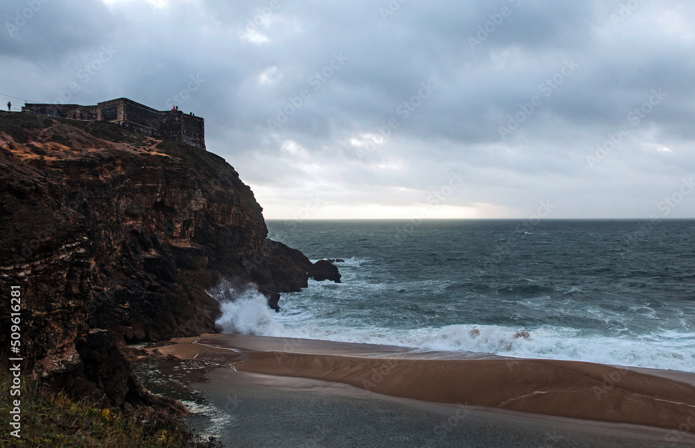 Image of the Atlantic coast of Nazaré, in Portugal, a cloudy day