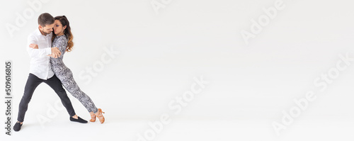 Banner salsa kizomba and bachata dancers on white background with copy space. Social dance concept