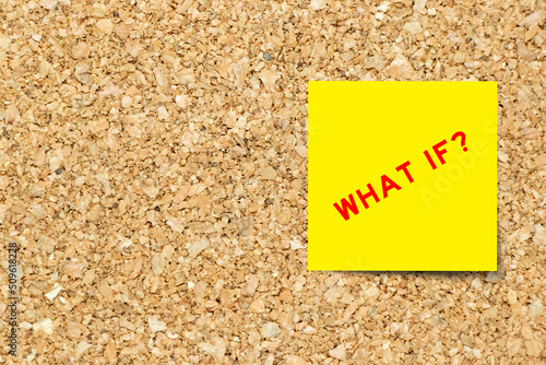 Photography Yellow note paper with word what if on cork board background with copy space