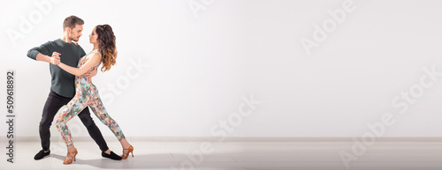Bild auf Leinwand Banner social dance bachata salsa kizomba zouk tango concept - Man hugs woman wh