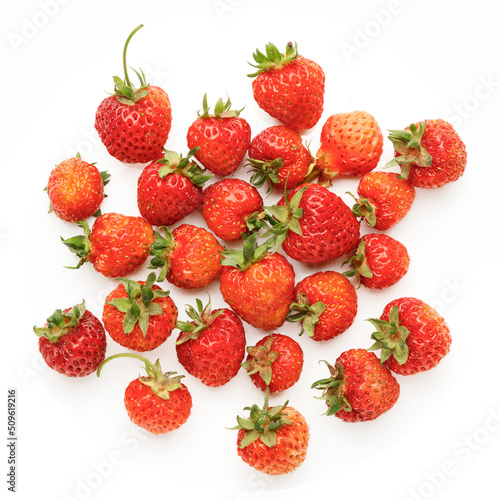 Juicy red strawberries on a white background, organic berries.