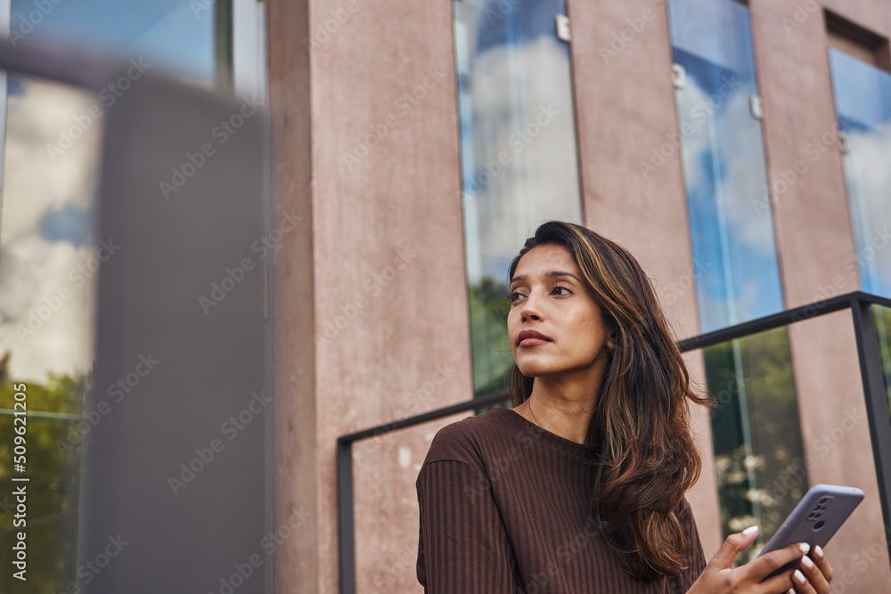 Fototapeta premium Young beautiful businesswoman looking and thinking