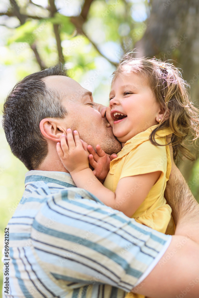 Father with his daughter having fun outside in forest Father with his daughter having fun outside in forest