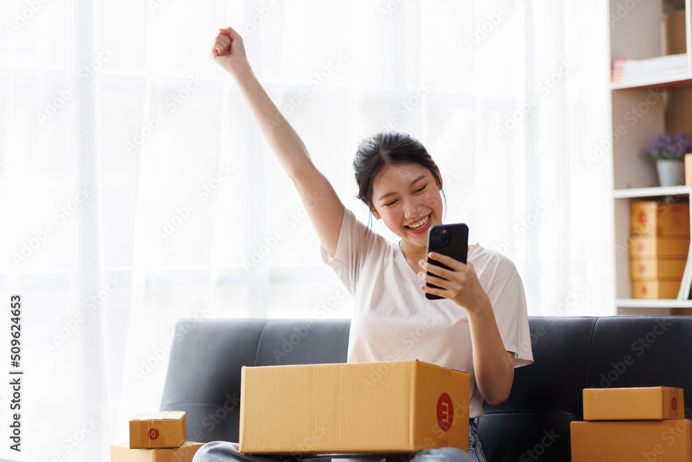 Business digital online SME small business a new startup in the present for an online shop. Happy Young Asian woman have a warehouse used to send a customer Entrepreneur owner SME or freelance concept Business digital online SME small business a new startup in the present for an online shop. Happy Young Asian woman have a warehouse used to send a customer Entrepreneur owner SME or freelance concept