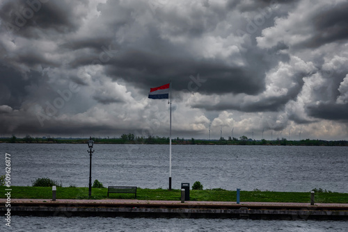Thick rain clouds over the Dutch North Sea at the port of Volendam © fotografci