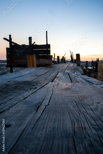 Carrasqueira Palafitic Pier in Portugal, at sunset photo