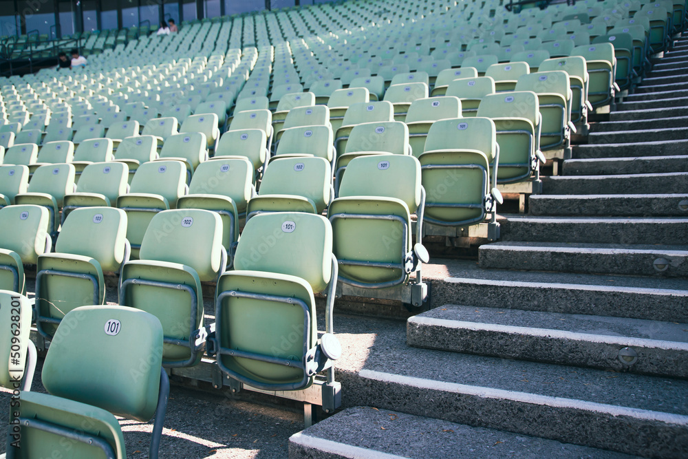 Obraz premium Empty Plastic Chairs at the Stadium