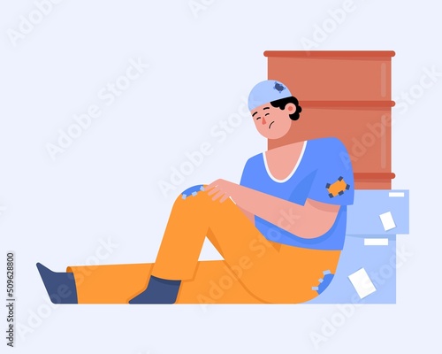 Homeless dirty man sitting on street near trash