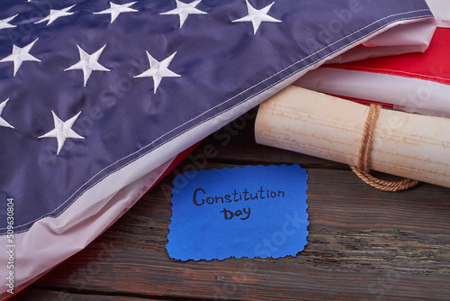 We the people written on the ancient scroll on wooden desk. United States constitution day concept.