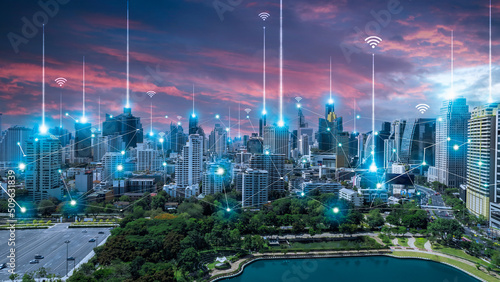 City scape with connecting dots for networking and communication in twilight. Internet globalization concept