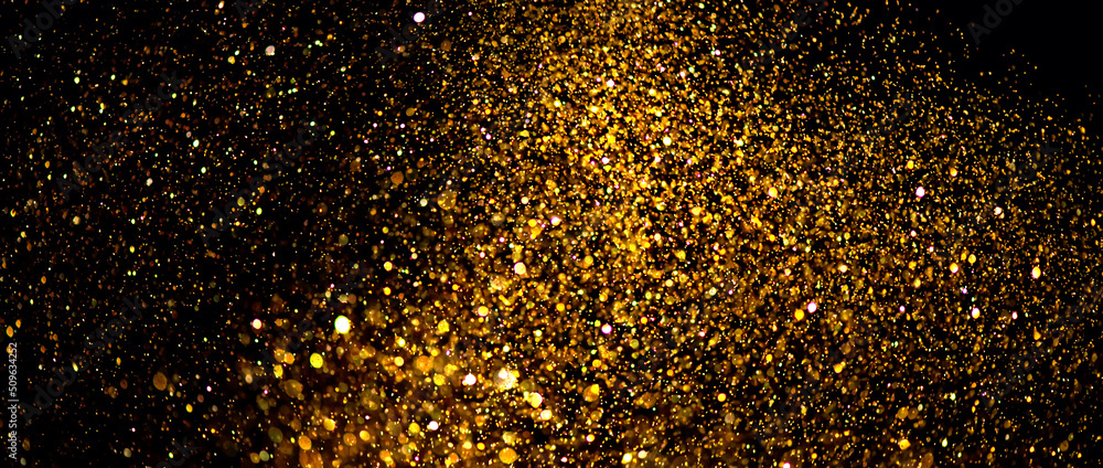 Golden sparks, Christmas and New Year glittering stars swirl on black bokeh background, backdrop with sparkling gold, holiday garland, magic glowing dust, lights. Gold Abstract Glitter Blinking sparks