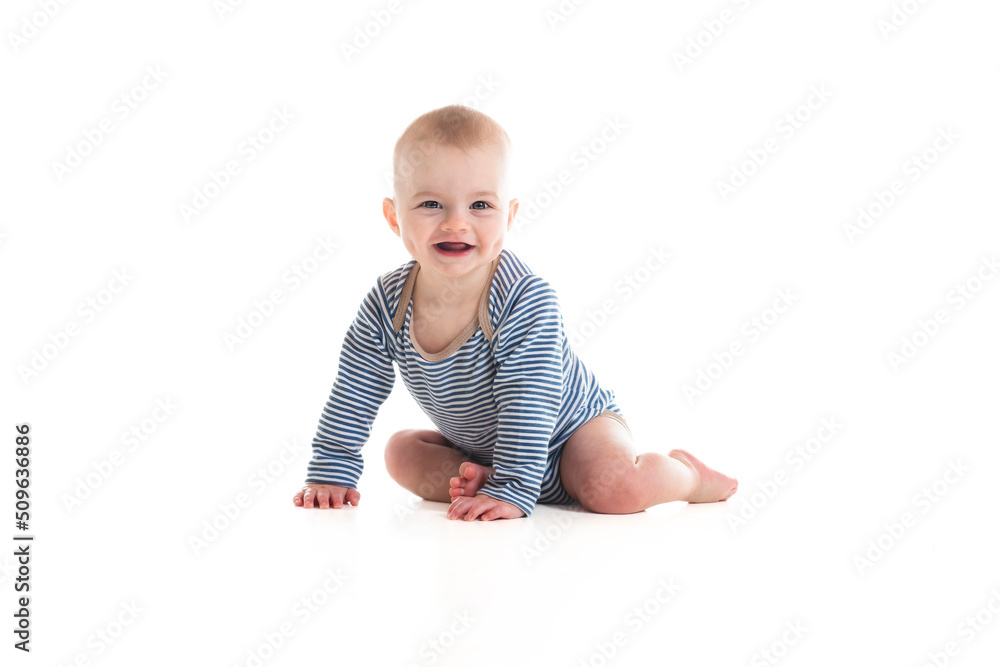 Cheerful baby boy toddler on white studio background Cheerful baby boy toddler on white studio background