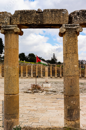  Jerash, Jordan - Jordanian flag in historical Jerash city (Grassa) Roman and Greek city