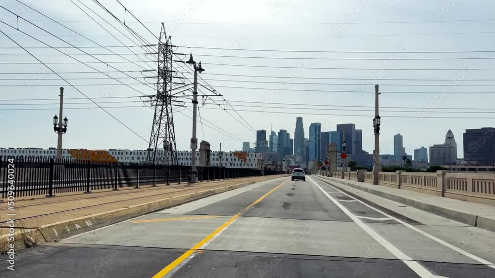 First Person View From Car Driving Over 1st Street Bridge To Urban Downtown Los Angeles First Person View From Car Driving Over 1st Street Bridge To Urban Downtown Los Angeles
