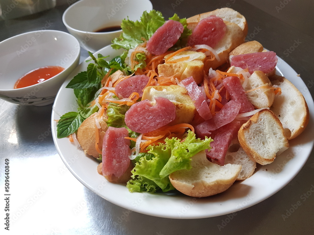 Fermented pork roll eat with bread, salad, onion, carot. Fermented pork roll eat with bread, salad, onion, carot.