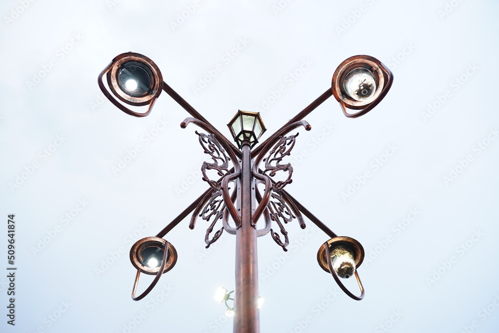 bronze garden lamp with vintage retro traditional carved design with 4 sides