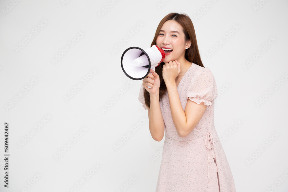Young Asian woman holding megaphone isolated on white background, Speech and announce concept Young Asian woman holding megaphone isolated on white background, Speech and announce concept