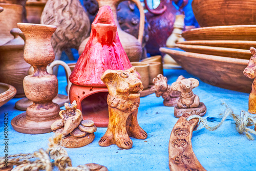 Traditional clay toys in form of different animals on market of National Sorochynsky Fair, Sorochyntsi, Ukraine photo