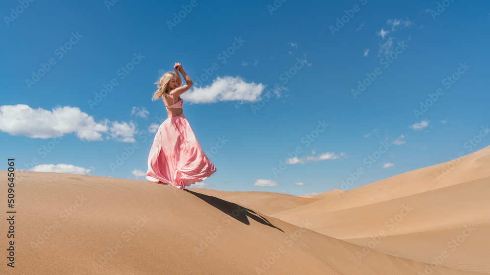 Portrait of a beautiful woman in an amazing dress in the desert Warm evening light, beautiful pastel colors, sand dunes on the horizon Portrait of a beautiful woman in an amazing dress in the desert Warm evening light, beautiful pastel colors, sand dunes on the horizon