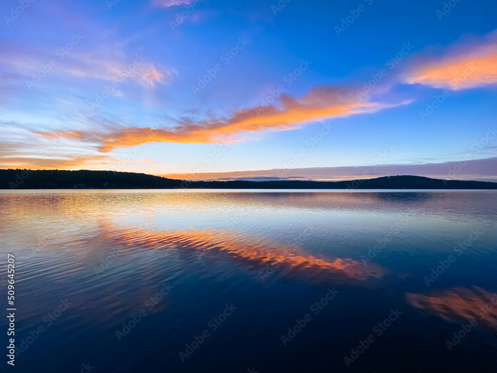Colorful Sunset Over Water with Clouds