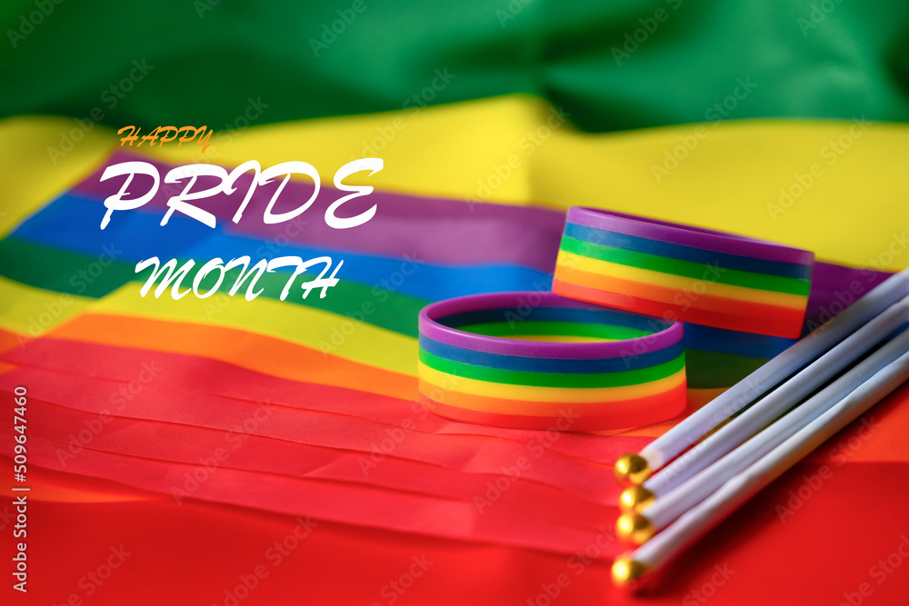 rainbow flags and wristband of lgbt symbol with .text "Happy pride
