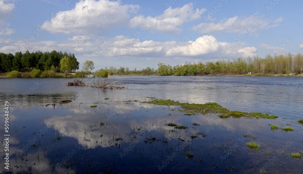 Reflection of clouds in the Pripyat River, the tributary of the Dnieper River, Ukraine