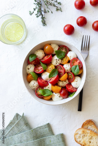 Salad with mozzarella, tomatoes and basil. Healthy eating. Vegetarian food.