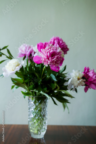 bouquet of flowers in vase. bouquet of white and pink peonies in a vase.