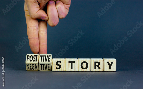 Positive or negative story symbol. Businessman turns cubes, changes concept words Negative story to Positive story. Beautiful grey background. Business positive or negative story concept. Copy space.