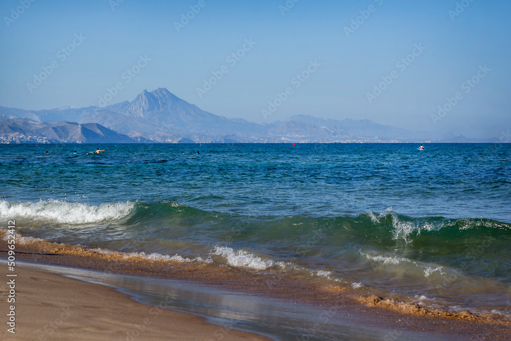 Sea in sunny weather. Waves. Mountains on the horizon. Alicante Sea in sunny weather. Waves. Mountains on the horizon. Alicante