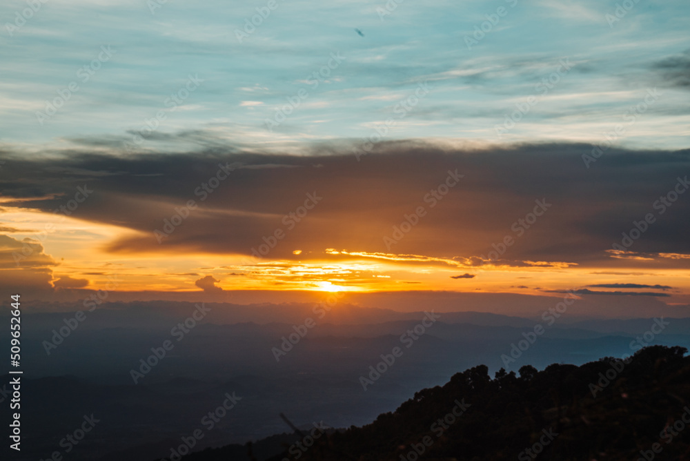 The view from the top of the mountain at sunset, taken from a bird's eye view