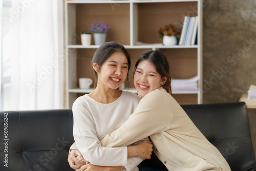 Asian lesbian couple, LGBTQ. Happy Two young Asia women showing love and romance together at home. Positive mood and moment of LGBT lesbian.