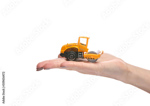 Paver model on the palm of the hand isolated on white background