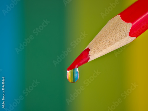 Colored pencil, water drop, close-up, macro.