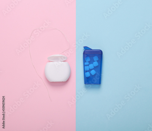 Wallpaper Mural Box of chewing gum for fresh breath and dental floss on a blue-pink pastel background. Top view Torontodigital.ca