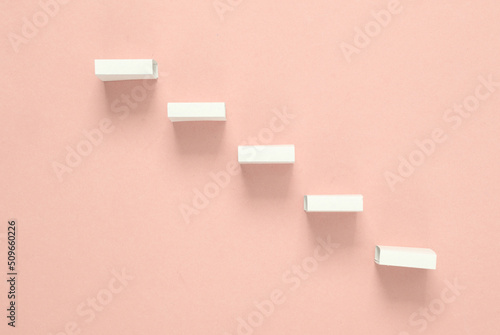 White steps on a pink background. Minimalism. Leadership, career development