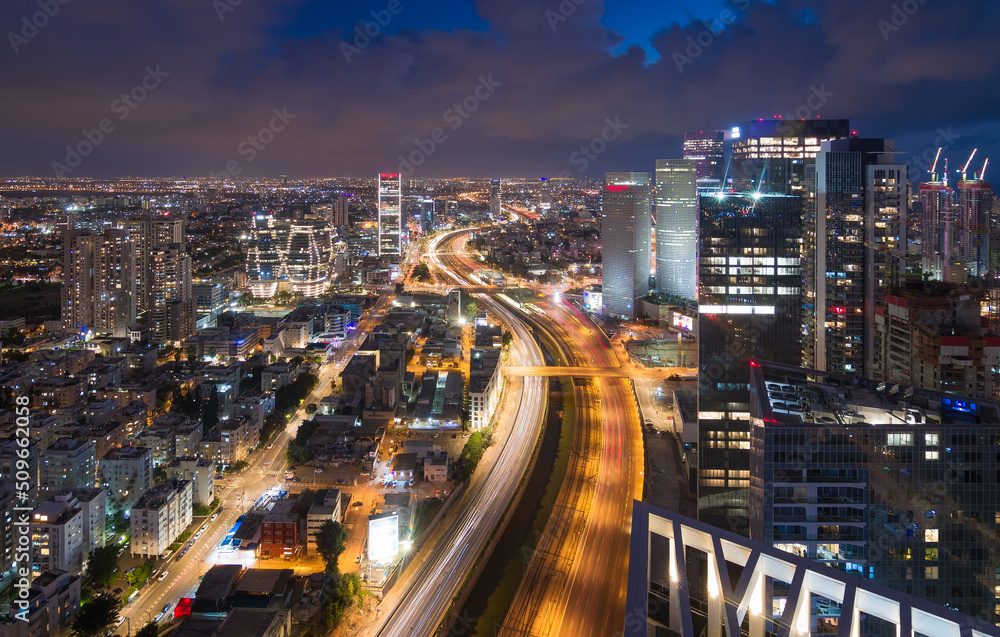 Fototapeta premium Tel Aviv, Israel. Ayalon river top night view. Modern glass skyscrapers