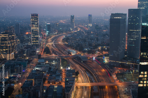 Tel Aviv city night panorama above: Ayalon river and modern skyscrapers