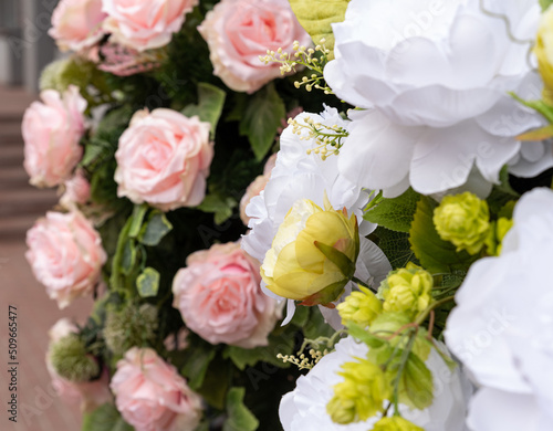 Artificial flowers in pastel colors. A bunch of artificial flowers. Ever-blooming bouquet. © PhotoRK