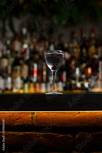 Obraz na płótnie Aviation, drink with gin, lemon juice, maraschino liqueur and violet cream liqueur standing on bar counter. w salonie