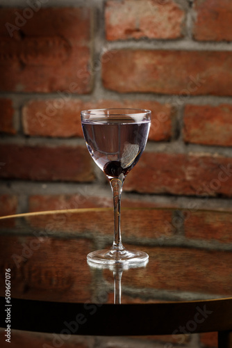 Obraz na płótnie Aviation, drink with gin, lemon juice, maraschino liqueur and violet cream liqueur standing on bar counter. w salonie
