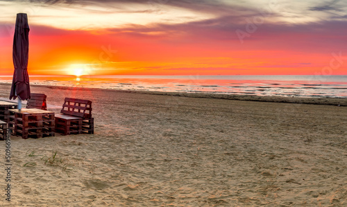 Colorful sunrise on sandy beach of the Baltic Sea © sergei_fish13