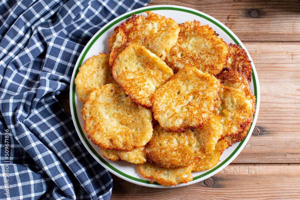 Potato pancakes. Stack of potato fritters. Top view Potato pancakes. Stack of potato fritters. Top view